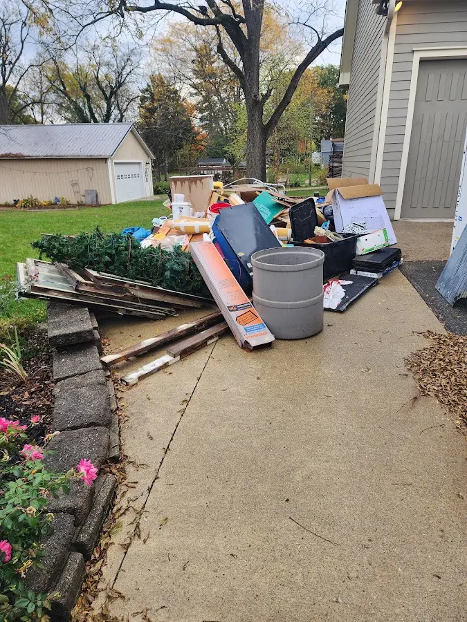 Dumpster being loaded with debris for 30 Yard Dumpster Rental in Warwick